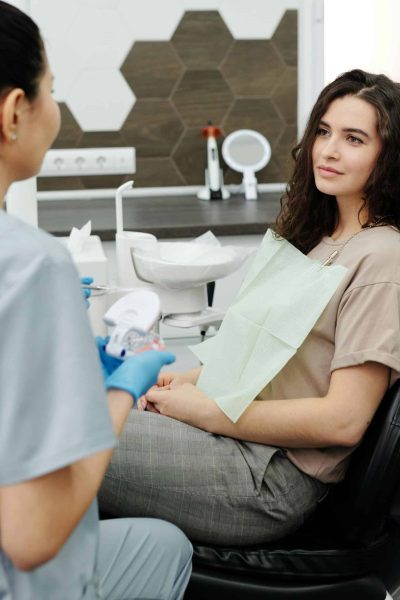 Emergency Dentist Roanoke - A Dentist Explaining To Her Patient The Dental Procedure